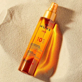 Nuxe Tanning Oil Водостійка сонцезахисна олія для обличчя та тіла SPF10 Спрей 150 мл